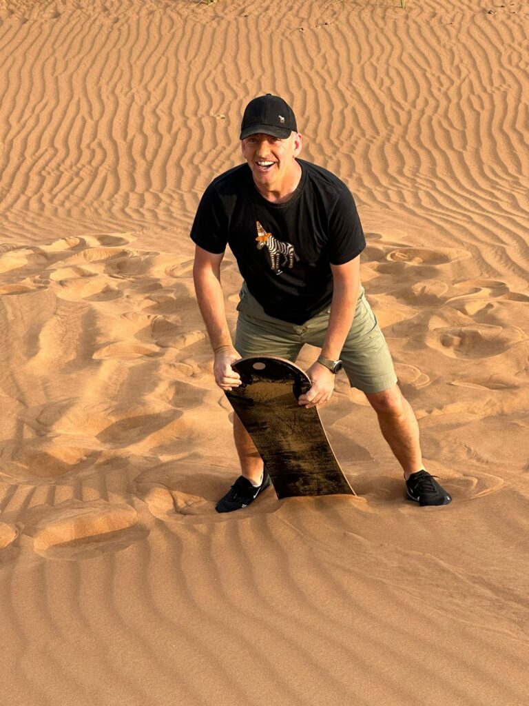 Sandboarding on the Dubai Desert Safari Experience